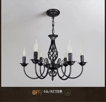 DecorBites modern black iron chandelier with six candle bulbs and ornate twisted design for living room lighting