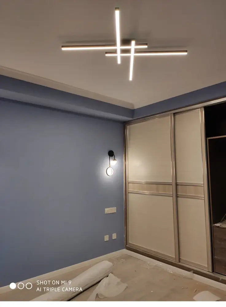 Modern black chandelier square with sleek illuminated bars by DecorBites for bedroom and living room lighting
