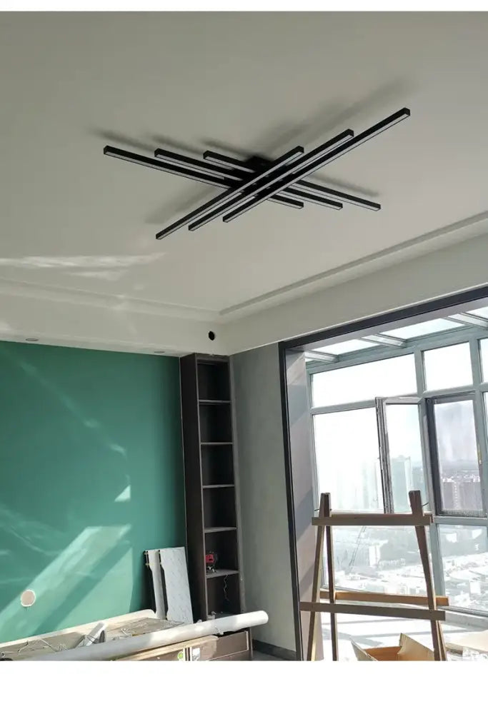 Black chandelier square featuring intersecting angular bars in modern led design for bedroom and living room lighting