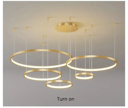 Modern black pendant light by decorbites featuring gold-finished illuminated rings ideal for living room lighting