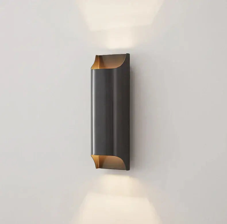 Modern brass led wall lamp by DecorBites featuring a sleek curved black and brass wall sconce design
