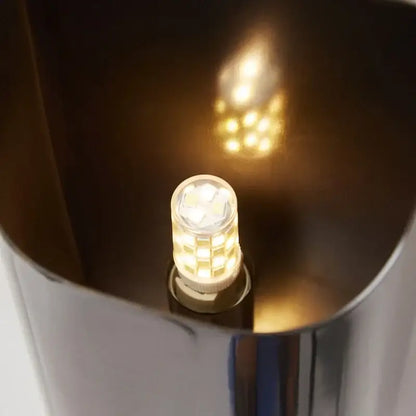 Decorbites wall lamp with warm-toned led bulb featuring clear faceted glass and modern brass led metallic base