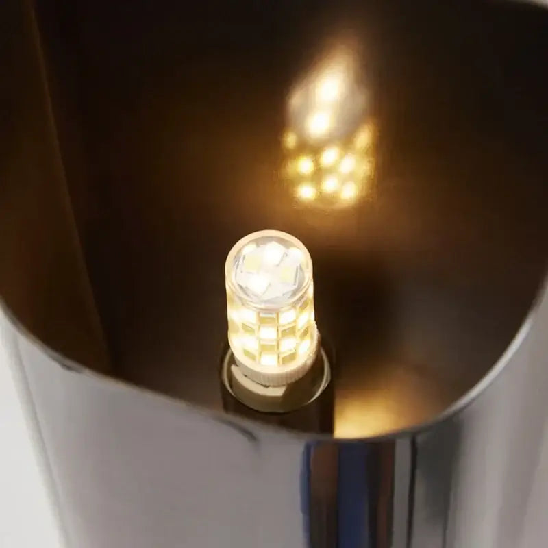 Decorbites wall lamp with warm-toned led bulb featuring clear faceted glass and modern brass led metallic base