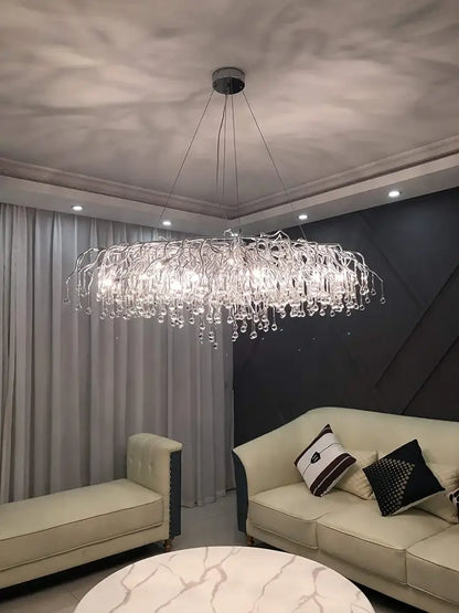 DecorBites™ modern chrome crystal chandelier features a silver-toned frame and clear glass droplets for living room