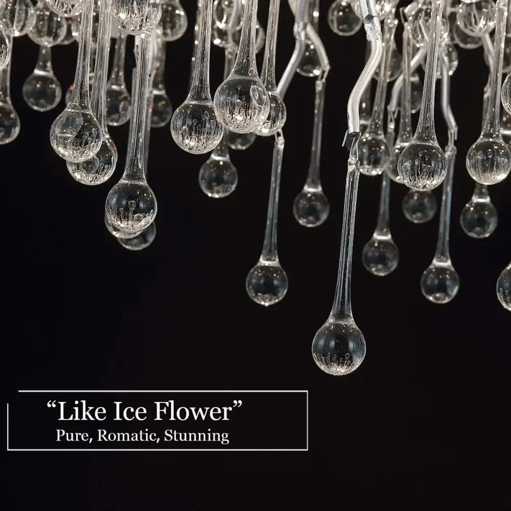 Clear glass teardrop elements with frosted detailing on decorbites™ modern chrome crystal chandelier for living room