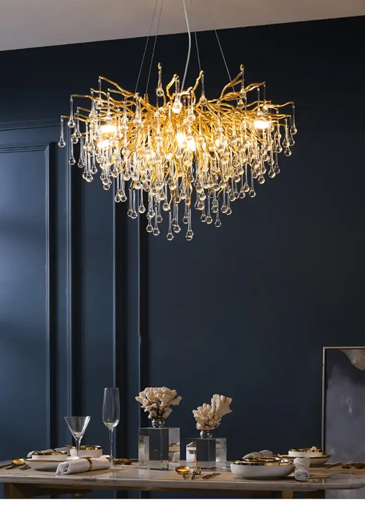 Golden branch-style crystal chandelier with dangling droplets for living room in decorbites™ modern chrome crystal design