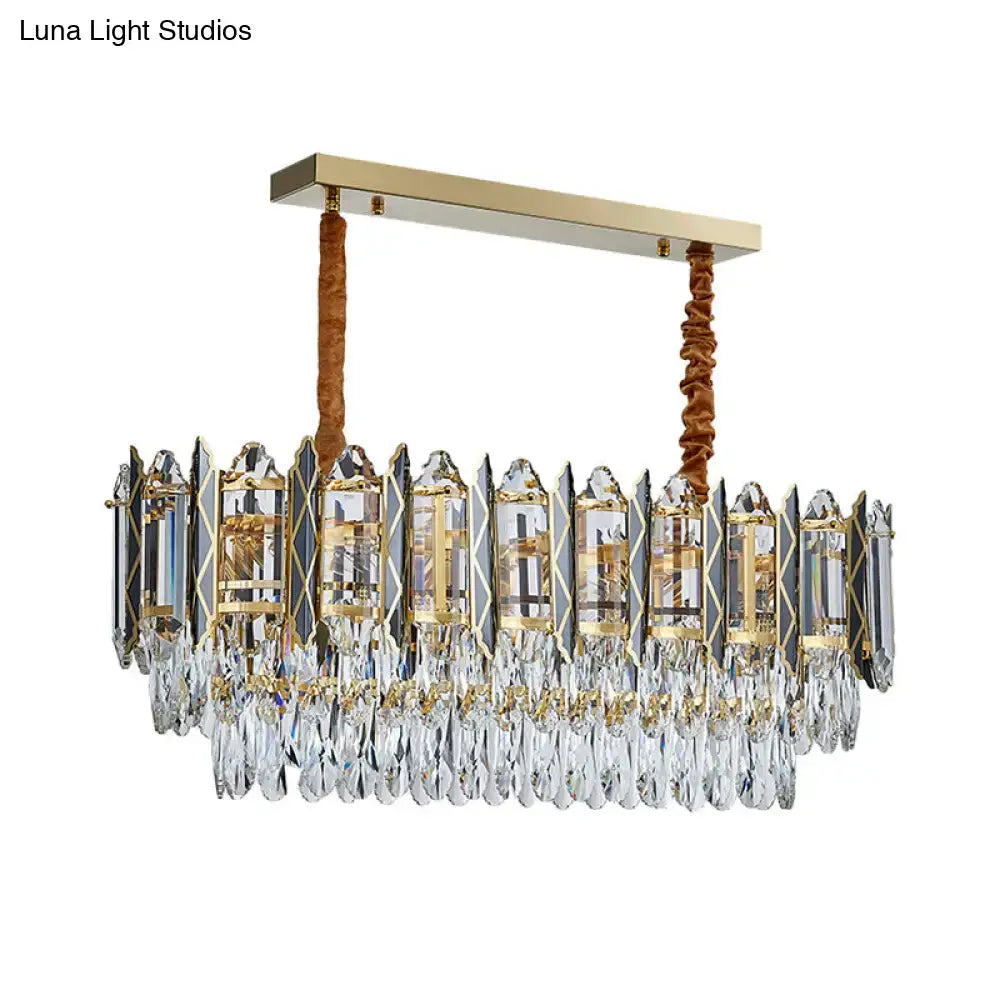Elegant decorbites crystal tiered oblong island light fixture with gold metal frame and clear teardrop crystals suspended by fabric cords