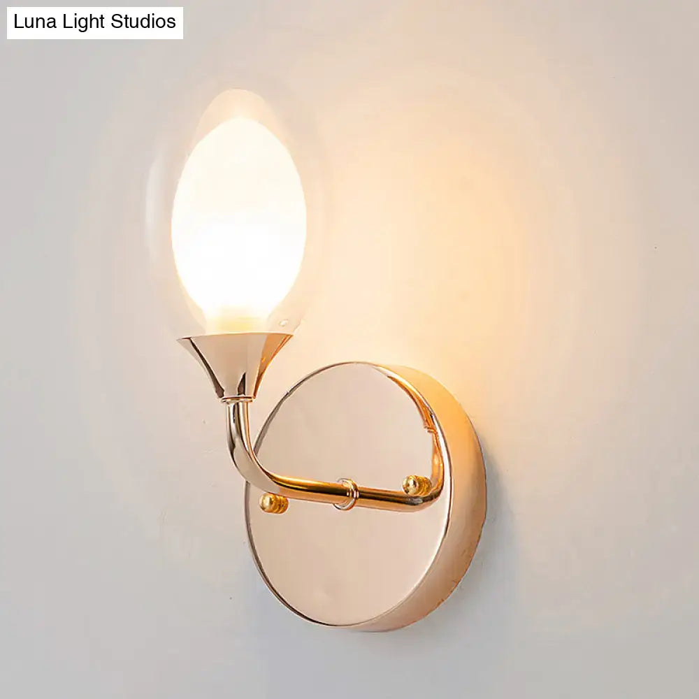 Modern gold wall lamp with sleek curved arm and oval frosted glass shade for stylish bedroom wall light fixture