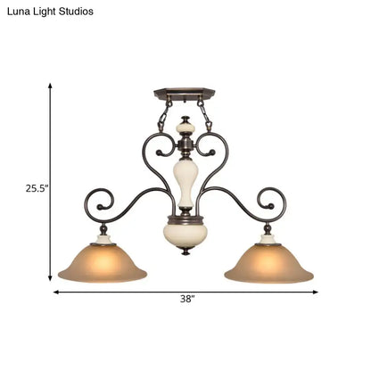 Antique bronze wrought iron chandelier with two warm white glass shades and cream ceramic accent for dining room lighting