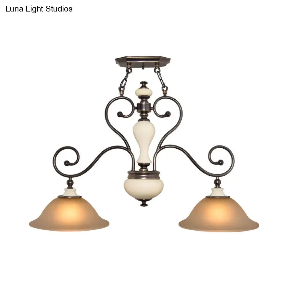 Antique bronze chandelier with cream white glass and ornate scrollwork arms perfect for dining room lighting