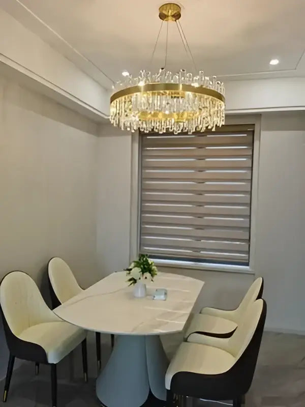 Decorbites modern crystal chandelier with golden chrome finish and cascading droplets for dining room lighting