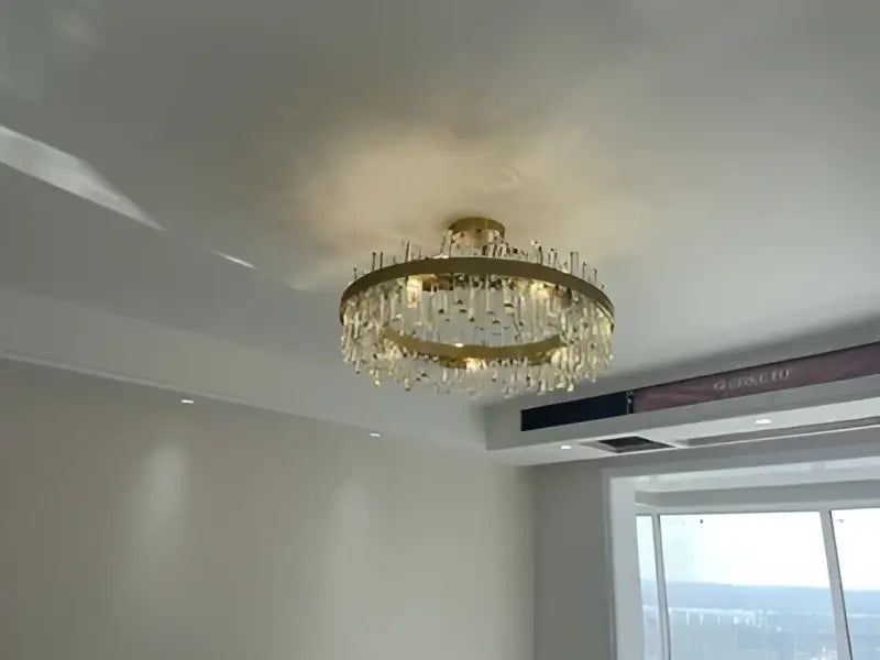 DecorBites modern crystal chandelier with golden chrome frame and dangling beads for dining room lighting