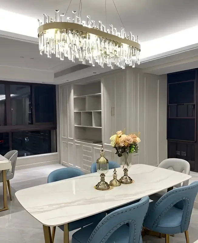 DecorBites™ modern crystal chandelier with golden chrome frame and cascading prisms for dining room lighting