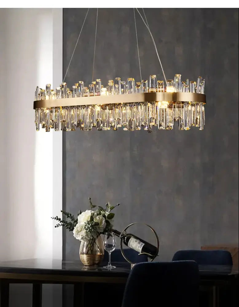 DecorBites™ modern crystal chandelier with golden chrome frame and hanging prisms for dining room lighting
