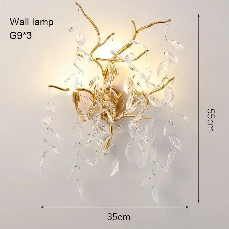 Gold-toned branch-style wall lamp with dangling clear crystal leaves for modern crystal living room ceiling chandelier