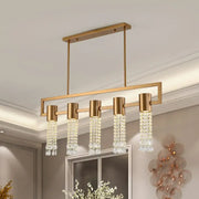Gold-toned rectangular DecorBites modern crystal draping brass island pendant lighting fixture with four cylindrical lights