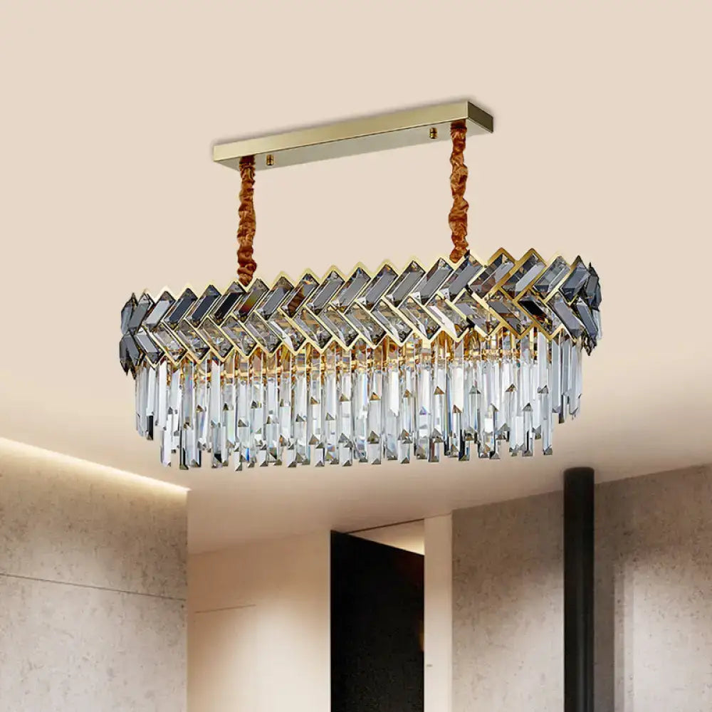 Gold-toned decorbites modern crystal ellipse pendant light with herringbone prisms and braided copper chain cord length