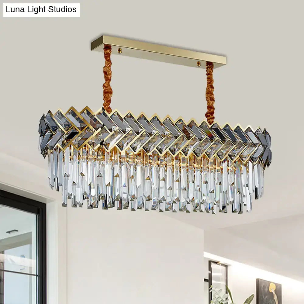 Gold-toned DecorBites modern crystal ellipse pendant light with faceted prisms and adjustable chain cord length for dining room