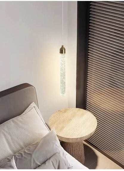 DecorBites modern crystal pendant light with gold fixtures features a sleek cylindrical design and clear crystal beads