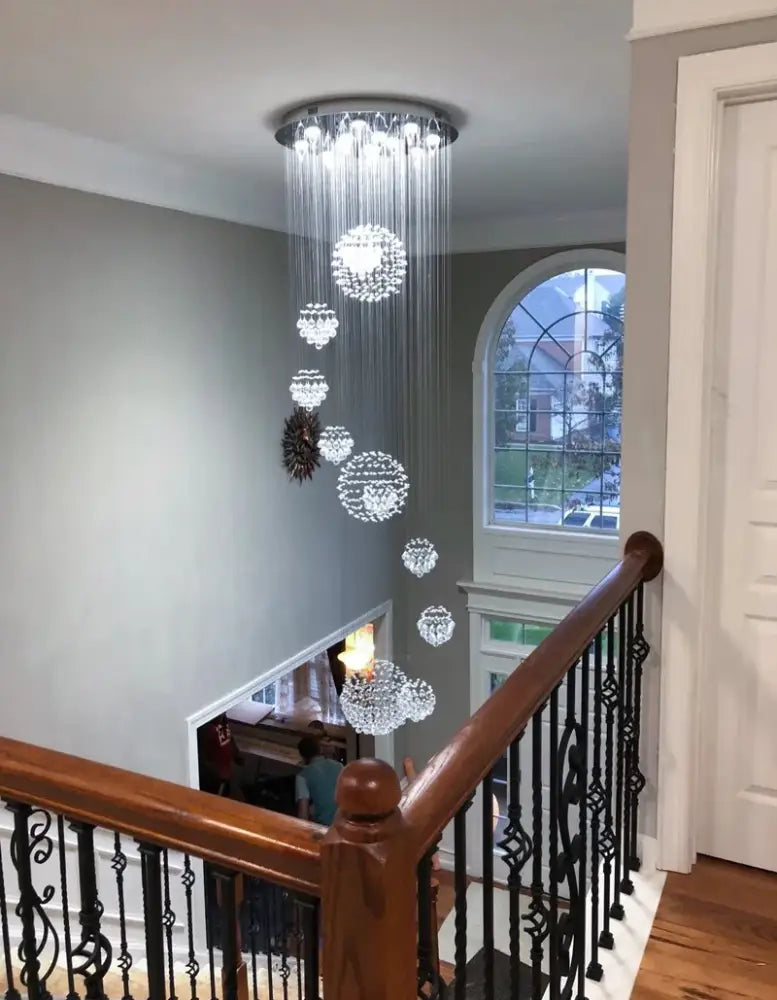 DecorBites modern crystal chandelier with 13 led bulbs features cascading spherical orbs for high ceiling spaces