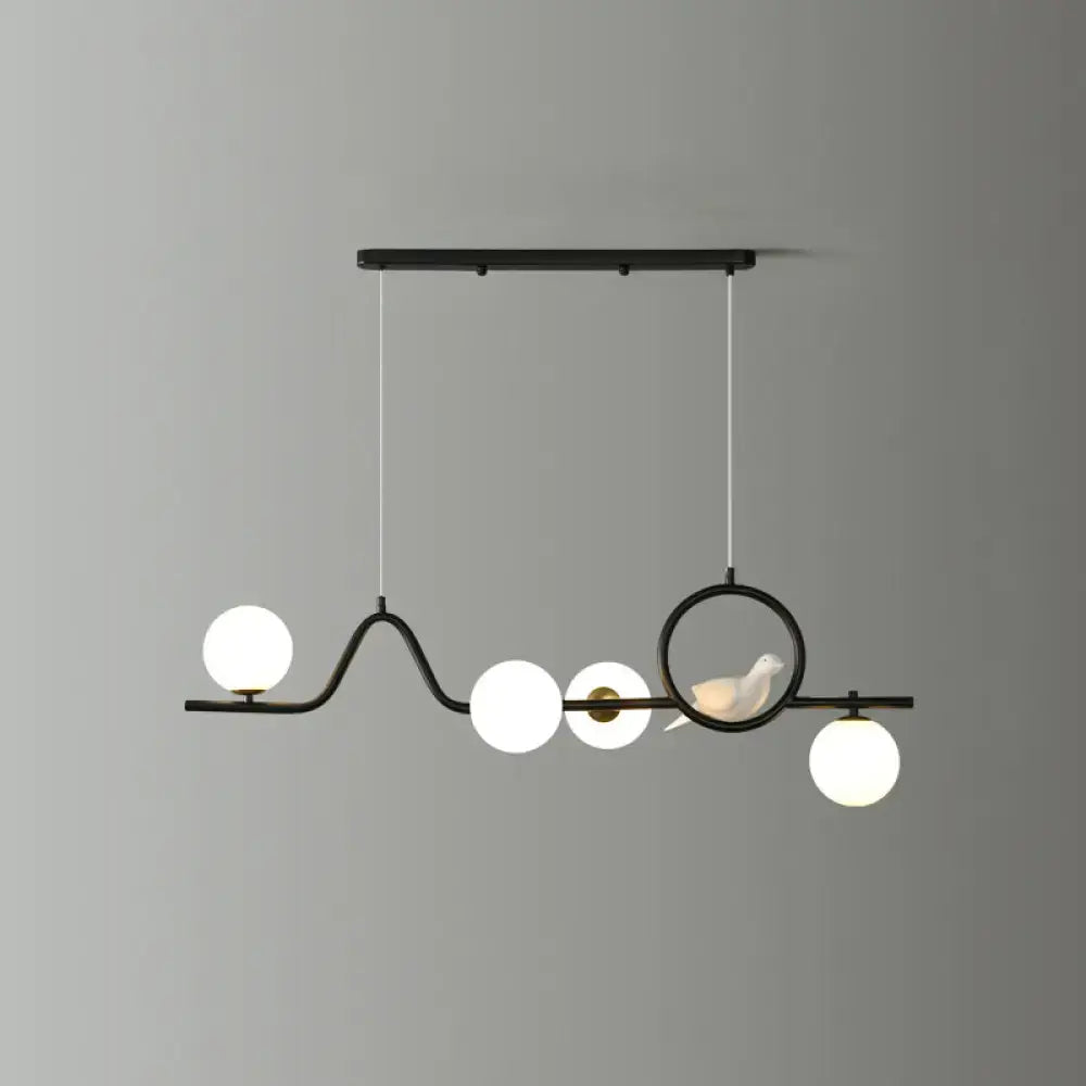 Decorbites™ modern curve island ceiling light with black metal pendant, four white glass ball bulbs, and bird accent for dining room