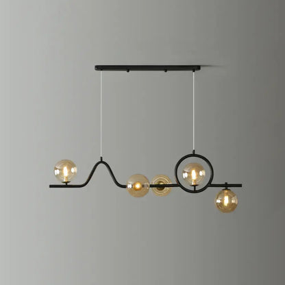 Black metal decorbites™ modern curve island ceiling light with five amber glass globe bulbs for dining room