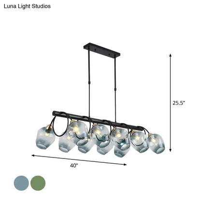Modern black metal chandelier with six frosted glass globes designed as a cup island light for elegant island lighting