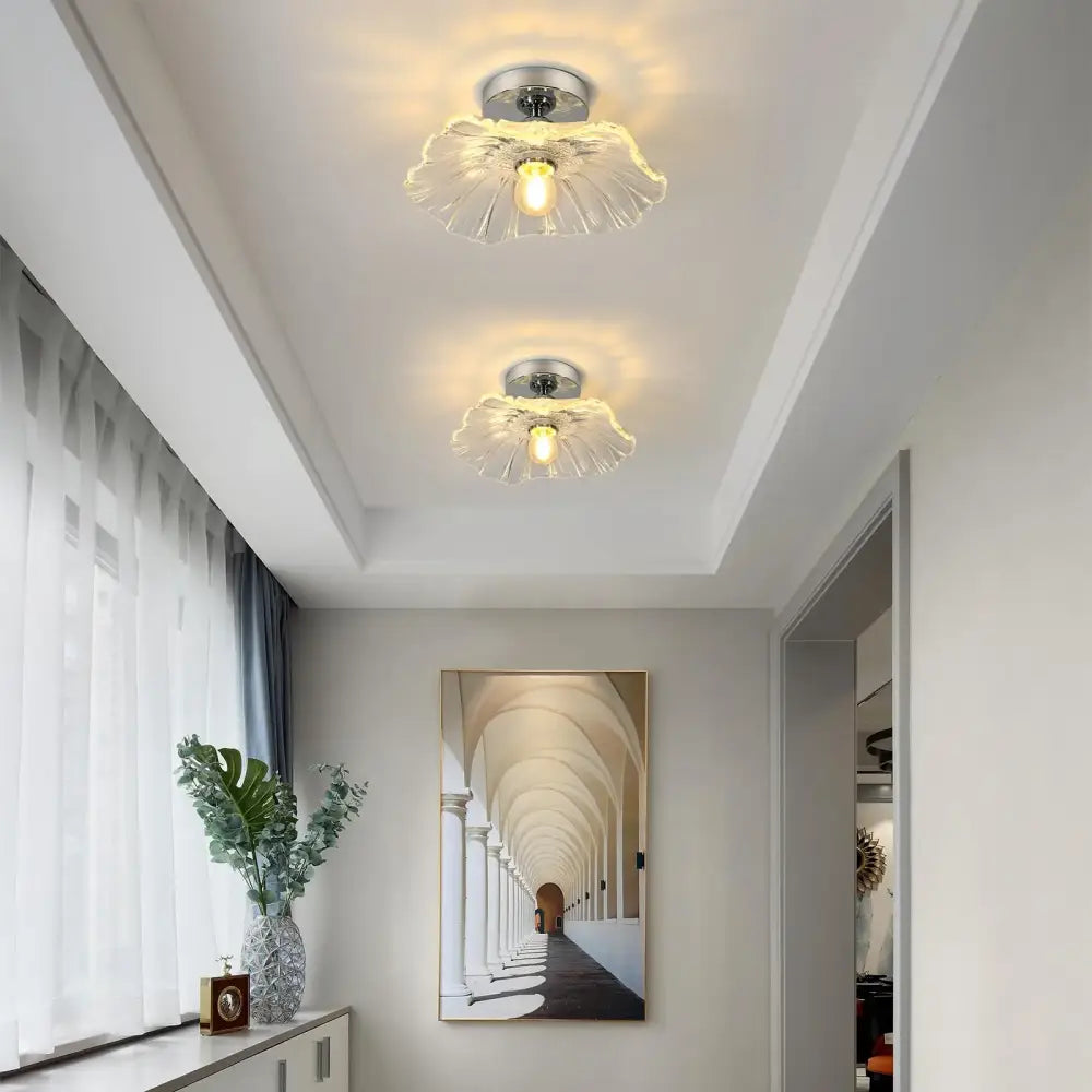Two matching ceiling lights with vintage glass translucent petal shades and chrome fixtures from DecorBites™ modern flower chandelier light