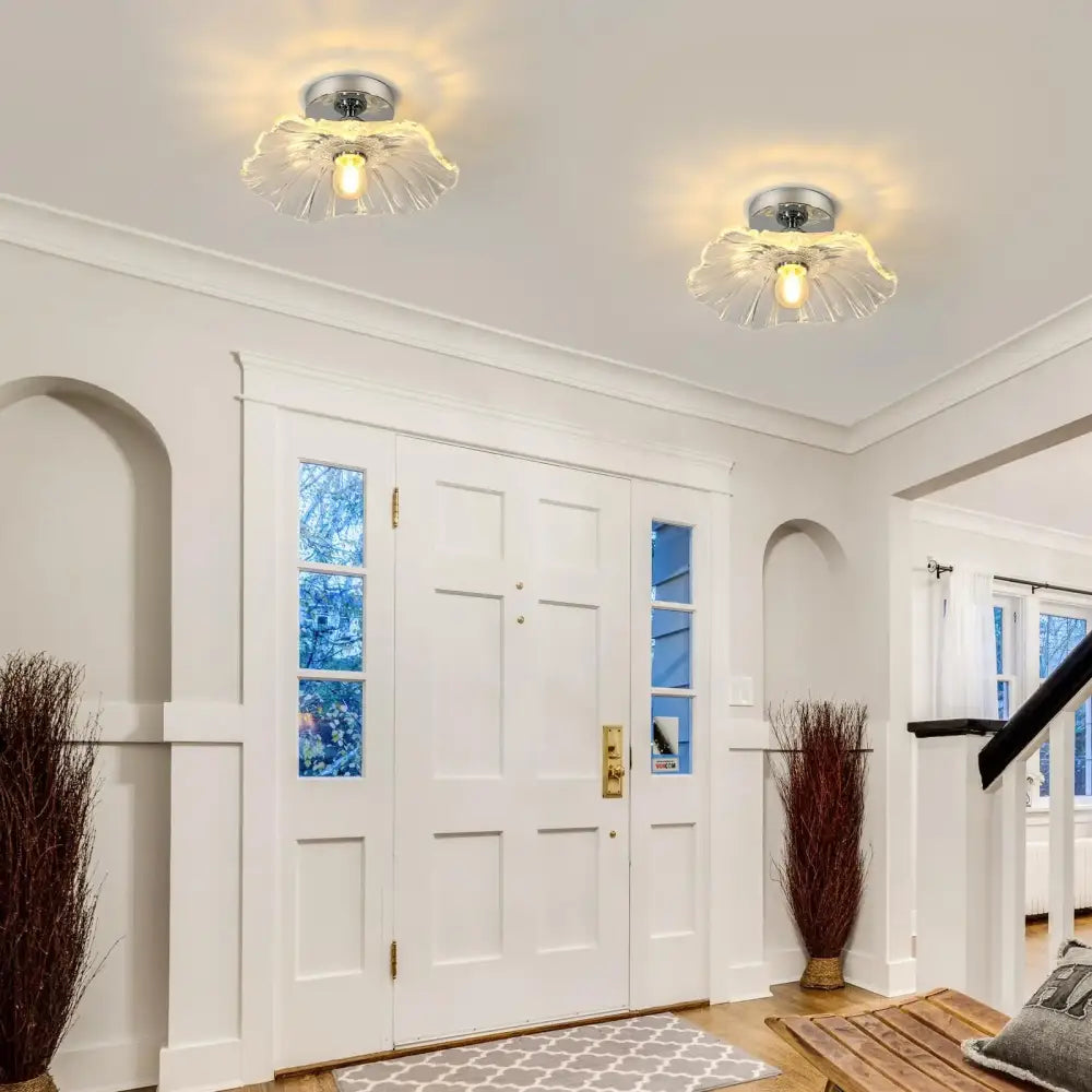 Two matching DecorBites™ modern flower ceiling lights with vintage clear glass petal shades and chrome metal bases