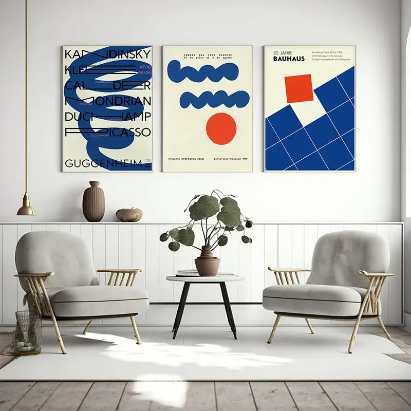 Three framed decorbites™ modern geometric bauhaus art print posters featuring bold blue orange and black designs on cream backgrounds