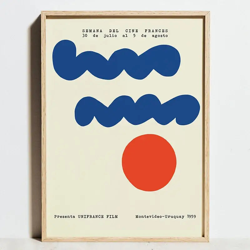 A framed decorbites™ modern geometric bauhaus wall art print with bold blue wavy lines and a red circle in a light wood frame