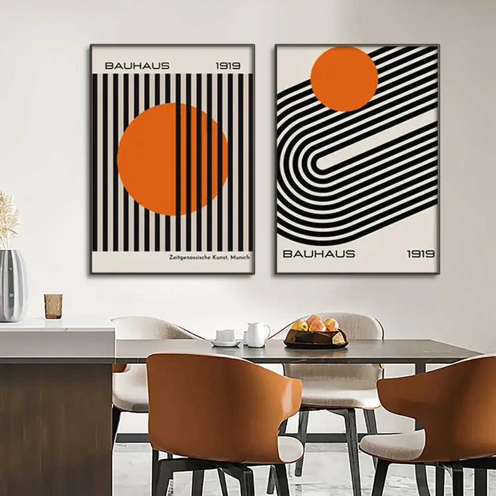 Two framed bauhaus style black and white geometric canvas wall art prints with vibrant orange accents from decorbites modern geometric canvas collection