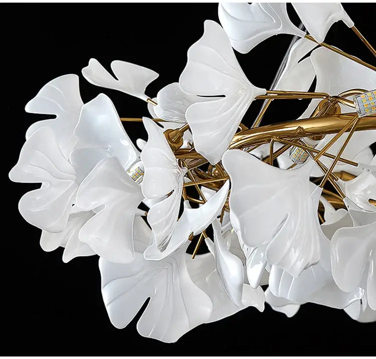 Elegant white porcelain ginkgo leaf chandelier with gold-toned metal branches for dining room lighting decorbites modern ginkgo led chandeliers