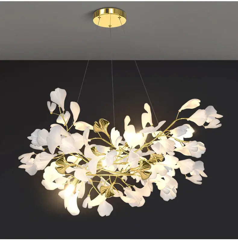 Elegant white and gold DecorBites™ modern ginkgo leaf LED chandelier designed for dining room lighting