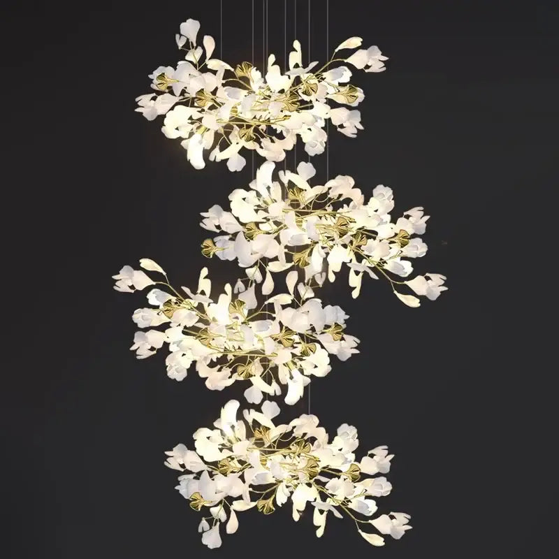 Elegant white and gold DecorBites™ modern ginkgo leaf LED chandelier with cascading petal shades for dining room lighting