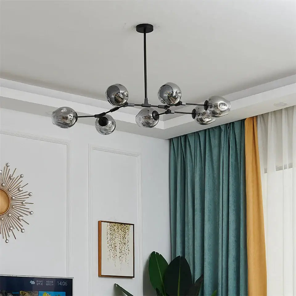 DecorBites modern black gold glass ball pendant chandelier with six reflective chrome spheres and central rod