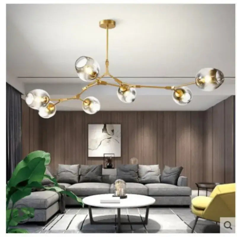 DecorBites modern glass ball pendant chandelier in black gold with gold-toned frame and clear glass globe bulbs