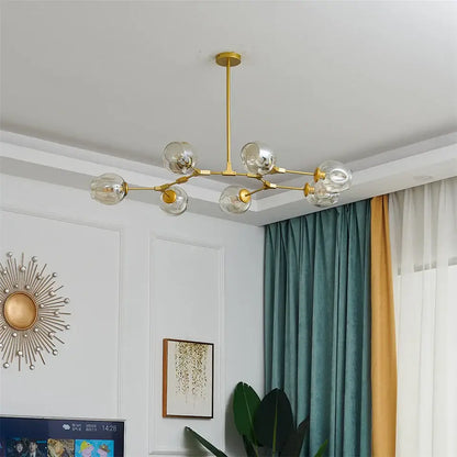 DecorBites™ modern glass ball pendant chandelier in black gold with six clear glass globe bulbs and nordic glass ball design