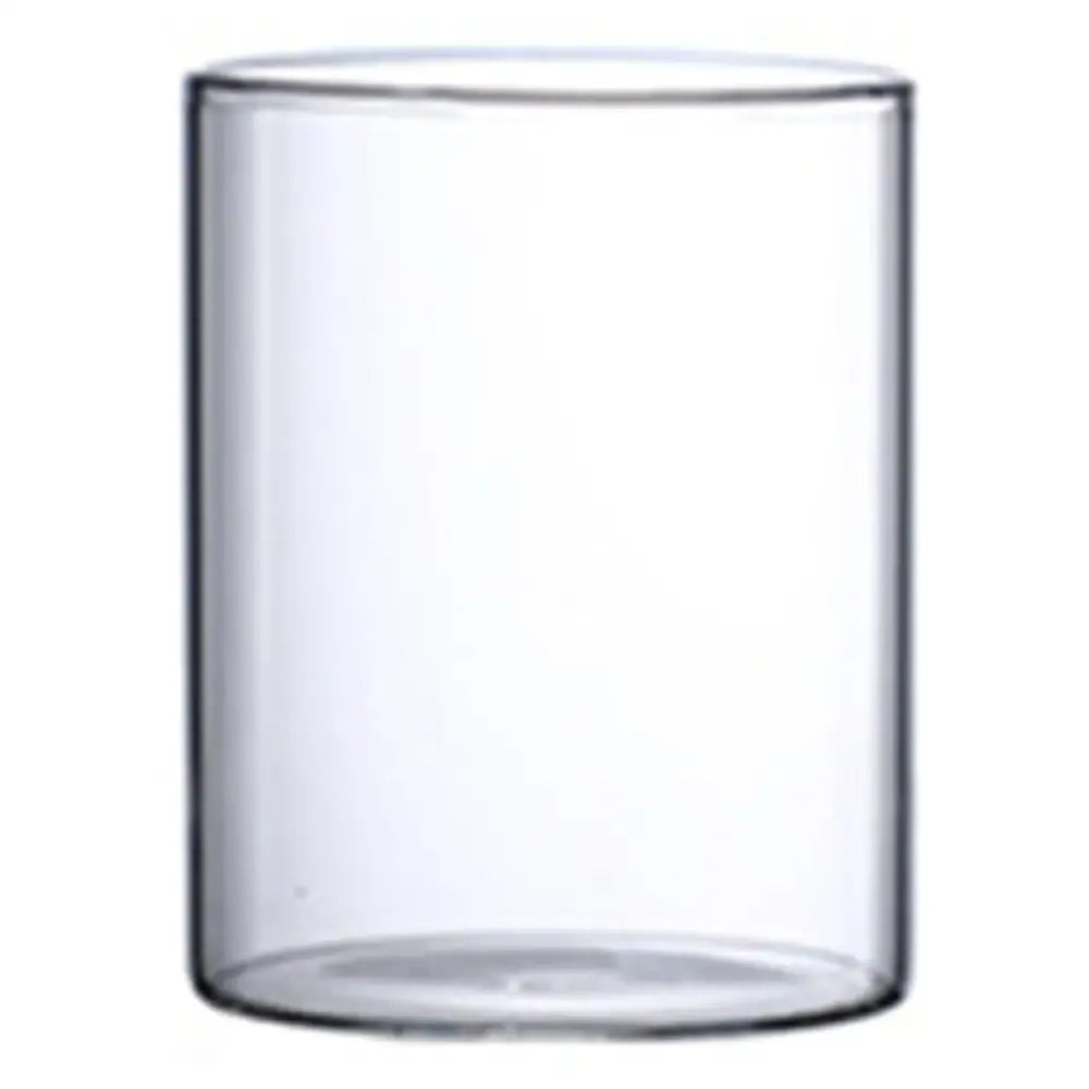 Clear cylindrical glass hydroponic vase with smooth transparent walls and rounded base for wedding decor by DecorBites