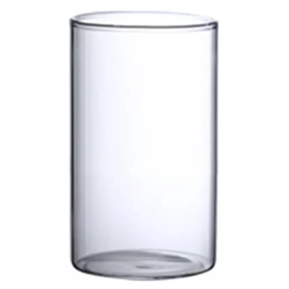 Clear cylindrical glass hydroponic vase with smooth walls and rounded base for modern wedding decor by decorbites