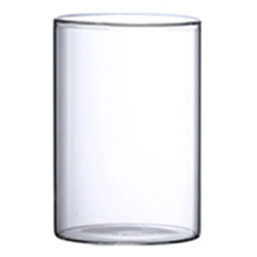 Clear cylindrical glass hydroponic vase with smooth transparent walls and rounded rim for wedding decor by decorbites