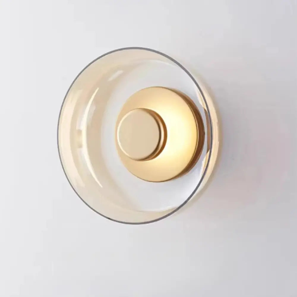 Decorbites™ modern glass led wall light features a minimalist wall light with translucent amber glass and polished brass accents