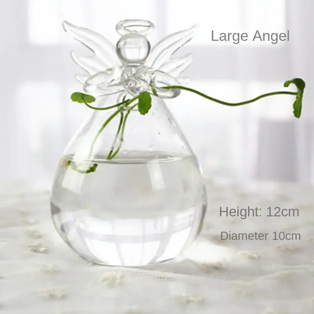 DecorBites modern clear glass vase terrarium shaped like an angel with wings and halo holding a small green plant