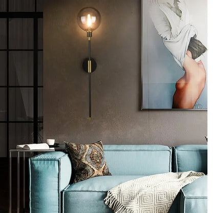 DecorBites™ modern glass wall sconce with spherical glass bulb and brass accents for elegant lighting solutions