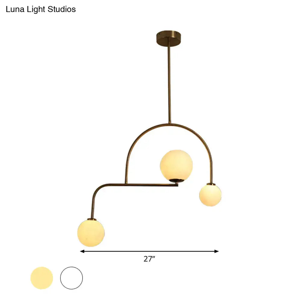 Decorbites modern global bedroom chandelier with brass finish and three yellow white frosted glass pendant shades