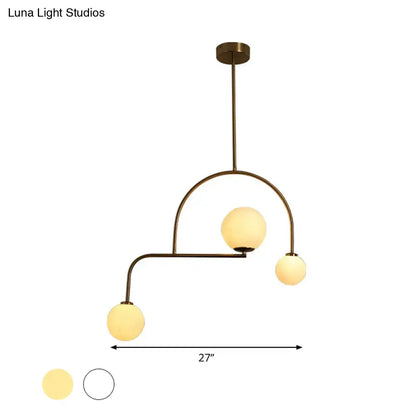 Decorbites modern global bedroom chandelier with brass finish and three yellow white frosted glass pendant shades