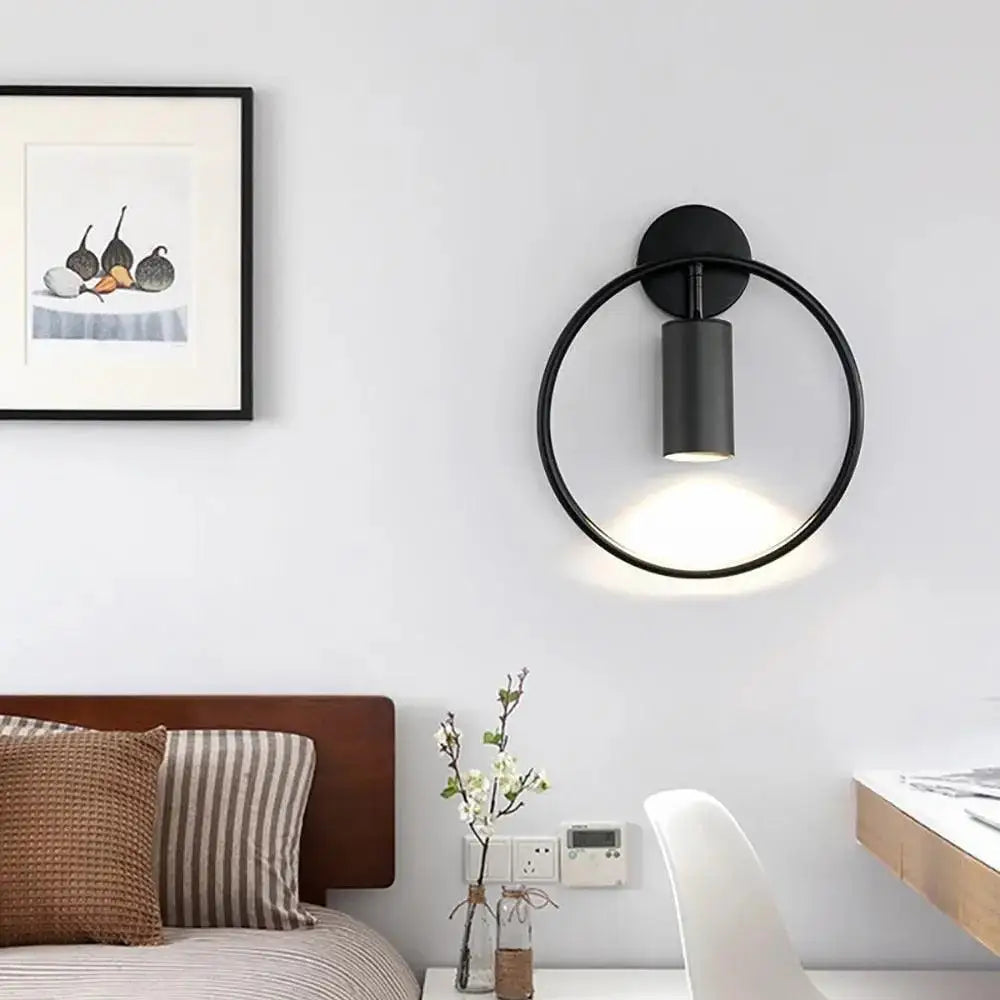 Black circular wall sconce DecorBites™ modern gold and black wall lamp with a cylindrical light fixture