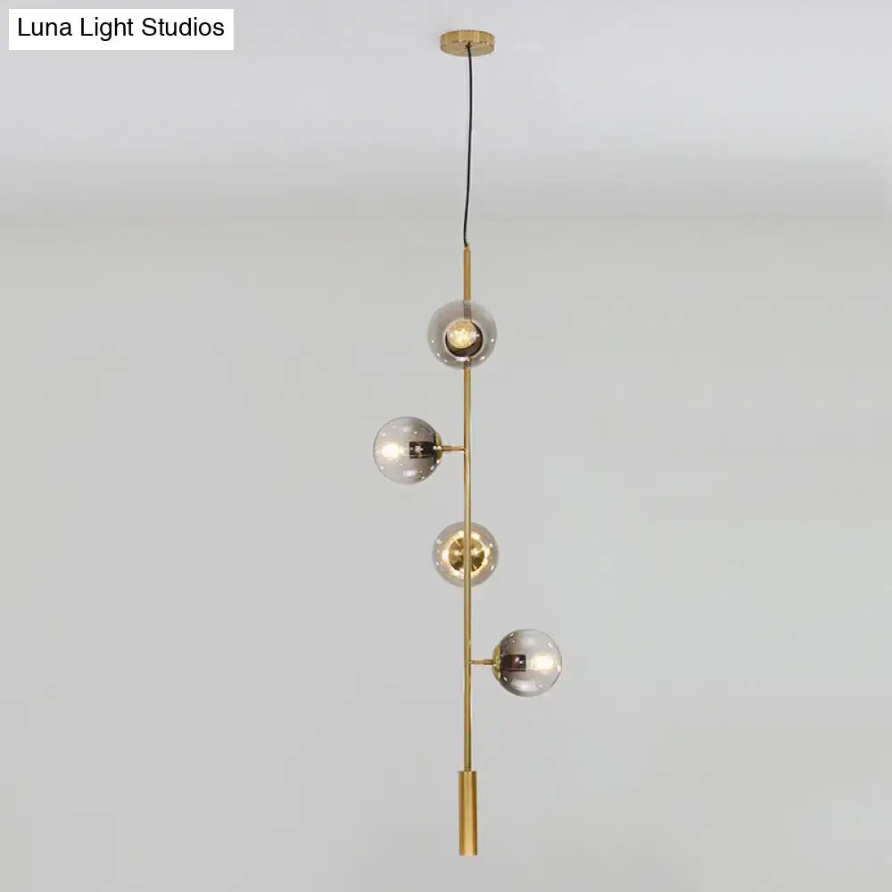 DecorBites modern gold linear chandelier with four gray glass shades and brass rod metal hanging fixture
