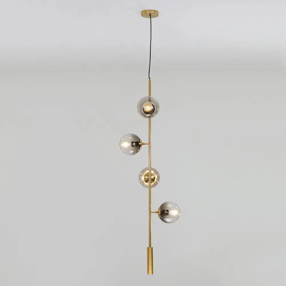DecorBites™ modern gold linear chandelier with four smoke gray glass shades on a slender metal rod hanging fixture