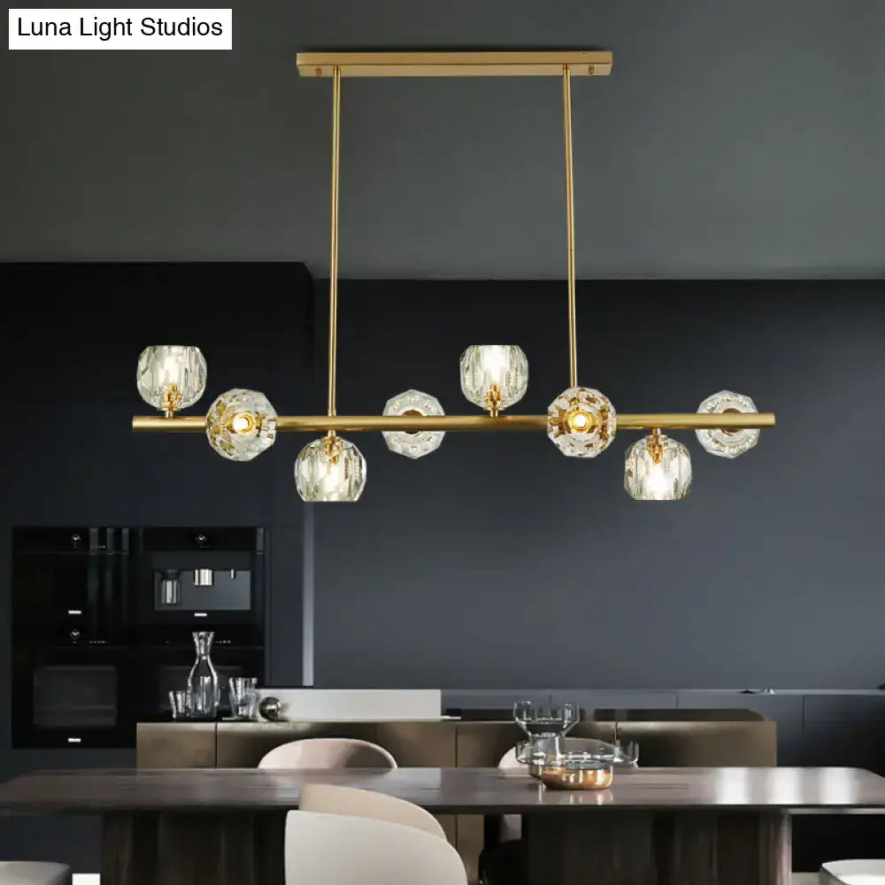 Decorbites modern gold pendant light with faceted crystal globe shades suspended by slender rods ideal for kitchens